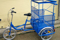 Tricycle with cage for street cleaning